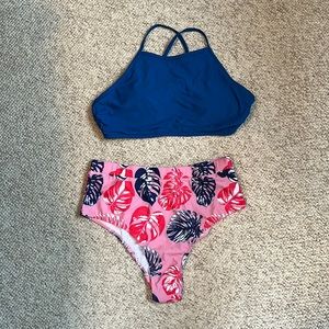 Brand new size XL two piece swim suit. Top ties in the back.
